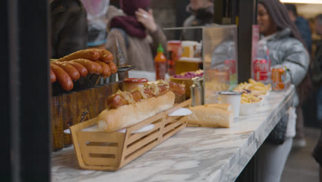 Close-Up-Of-Food-Stall-Selling-Hot-Dogs-In-Camden-Lock-Market-In-North-London-UK